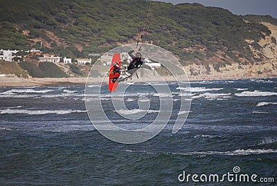 Kiter flying on the waves near Tarifa, Spain Stock Photo