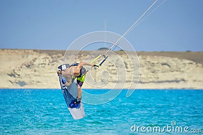 Kiteboarder performing kiteboarding jumps and tricks Editorial Stock Photo