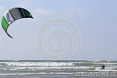 Kitesurfer riding in the surf Editorial Stock Photo