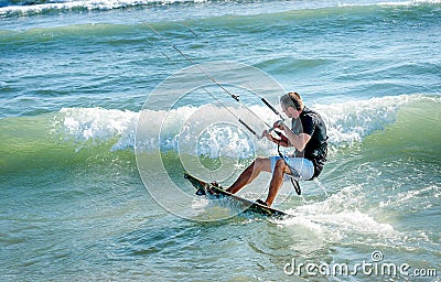 Kitesurfer riding on Kiteboard on the beach in Ulcinj, Montenegr Stock Photo