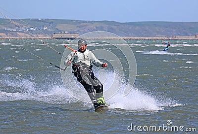 Kitesurfer riding at speed Editorial Stock Photo