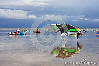 Kitesurfers on a beach Stock Photo