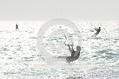 Kitesurfers in water Stock Photo