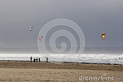 Kitesurfers on Saunton Sands beach Stock Photo
