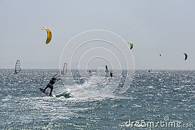 Kitesurfers in the summer at sea. Tarifa. Spain. Editorial Stock Photo