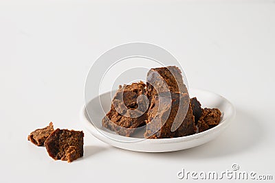 Kithul jaggery and treacle natural sweetener in bowl. Alternative sugar and superfood. Stock Photo