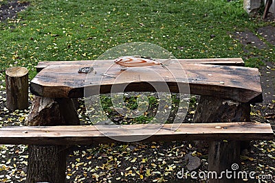 Kitschy glass fish on a wooden table Stock Photo