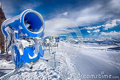 KITZBUEHEL, AUSTRIA - February 17, 2016 - Snow cannons with fresh prepared ski slopes with the corduroy pattern in Kitzbuehel ski Editorial Stock Photo