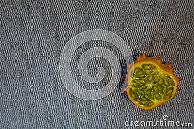 Kiwano slice on grey textile Stock Photo