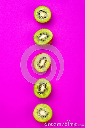 Kiwi fruit pattern on pink colored background, minimal flat lay style, copy space. Stock Photo