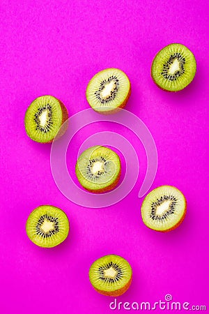 Kiwi fruit pattern on pink colored background, minimal flat lay style, copy space. Stock Photo