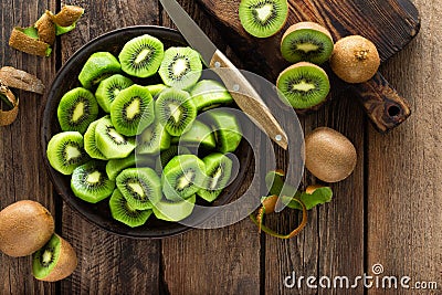 Kiwi fruit on wooden rustic table, ingredient for detox smoothie Stock Photo