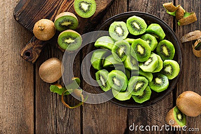 Kiwi fruit on wooden rustic table, ingredient for detox smoothie Stock Photo