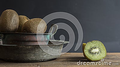 Kiwi fruit on wooden surface Stock Photo