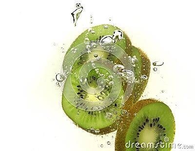 Kiwi slices and bubbles Stock Photo