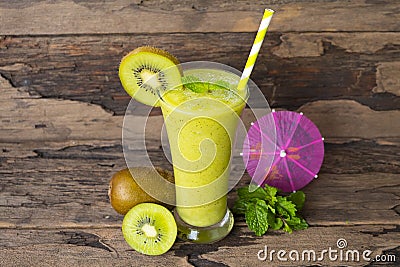 Kiwi yogurt smoothies juice and kiwi green fruit for breakfast in the morning on wood background. Stock Photo