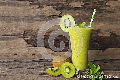 Kiwi yogurt smoothies juice and kiwi green fruit for breakfast in the morning on wood background. Stock Photo