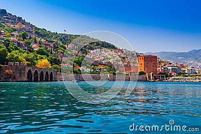 Kizil Kule tower in Alanya peninsula, Antalya district, Turkey, Asia. Famous tourist destination with high mountains. Part of Stock Photo