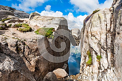 Kjeragbolten - famous landmark on Kjerag mountain, Norway. Stock Photo