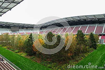 Klagenfurt - A forest planted in the middle of the football stadium in Klagenfurt, Austria. The pitch turf resembles the forest Editorial Stock Photo