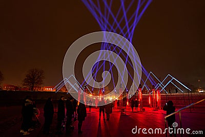 Klaipeda, LITHUANIA - February 23, 2023 - People inside the light installation at the Light Festival in Lithuania Editorial Stock Photo