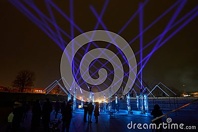 Klaipeda, Lithuania - February 23, 2023 - People inside the light installation at the Festival of Light Editorial Stock Photo