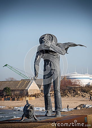 Klaipeda, Lithuania- 21 february 2021: Walking with a fish monument. Editorial Stock Photo