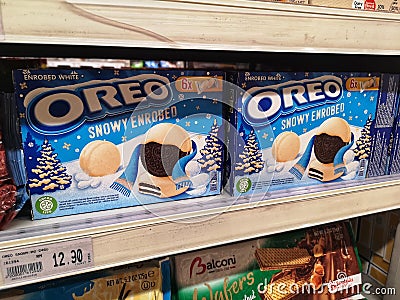Klang,Malaysia - 30 October 2021 : Displayed of OREO Snowy Enrobed Sandwich Cookies Flavour for sell on the supermarket shelf. Editorial Stock Photo