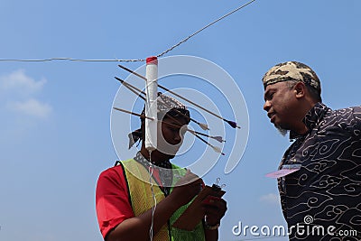 Klaten, Indonesia, august 15, 2023. male and female participants, dressed in Javanese custom pulled his bow by squinting to Editorial Stock Photo