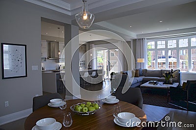 A newly designed model home with kitchen, living room and dining table Editorial Stock Photo
