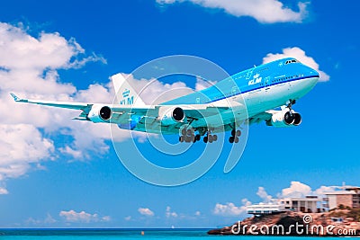 KLM 747 over Maho Beach, St. Maarten Editorial Stock Photo