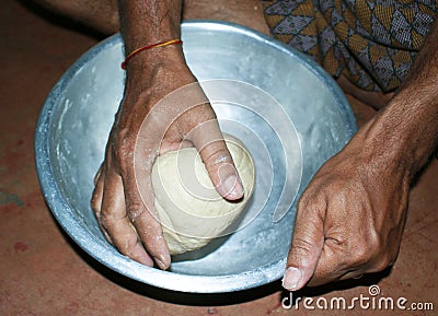 Kneading flour dough manually Stock Photo