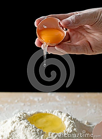 Kneading test with handson black background Stock Photo