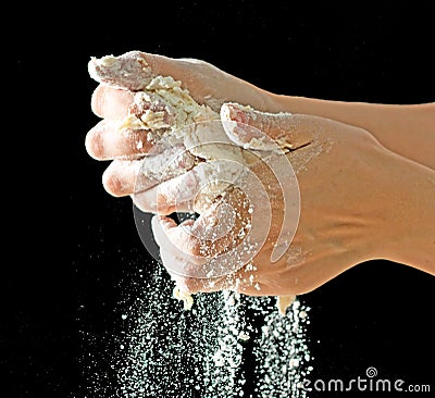 Kneading test with hands on black background Stock Photo