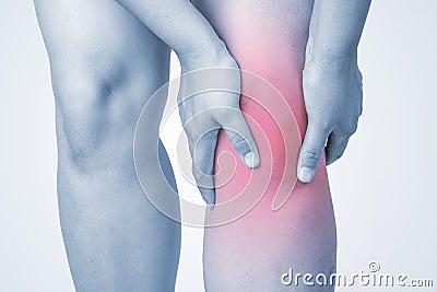 Knee injury in humans .knee pain,joint pains people medical, mono tone highlight at knee Stock Photo