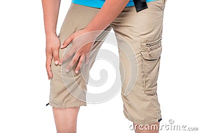 Knee pain, male hands clasped knee close-up Stock Photo