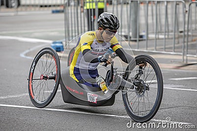 A kneeling Para Cyclist races along Pulteney Street in Adelaide. Editorial Stock Photo