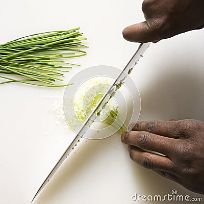 Knife chopping chives. Stock Photo