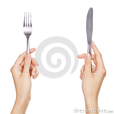 A knife and fork being held by womans hands. Stock Photo