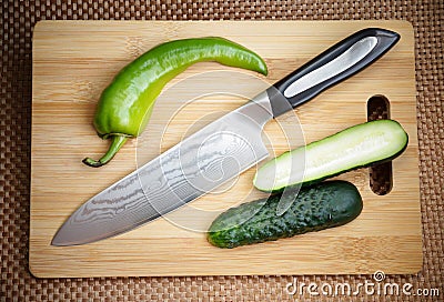 Knife kitchen with a blade from Damask steel Stock Photo