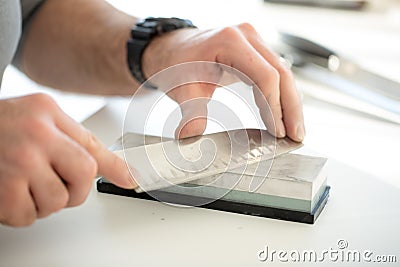 Knife sharpening Stock Photo