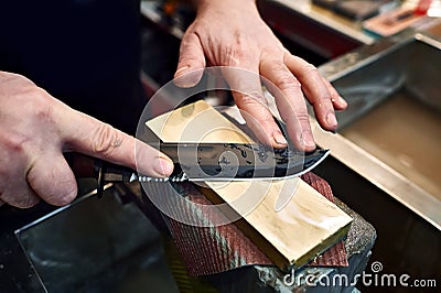 Knife sharpening Stock Photo