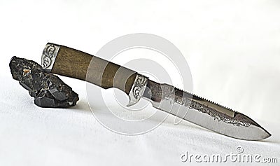 Knife and Tourmaline cristall Stock Photo