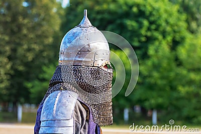 Knight in combat armor close up in profile_ Stock Photo