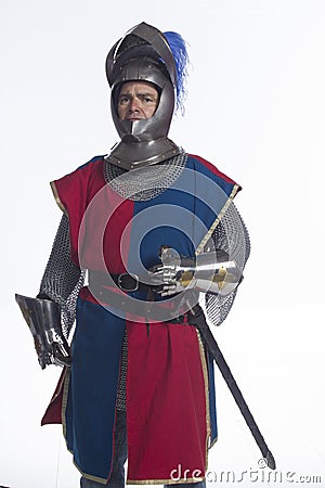 Knight in full armor with shield and sword, vertical Stock Photo