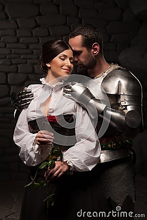 Knight giving a rose to lady Stock Photo