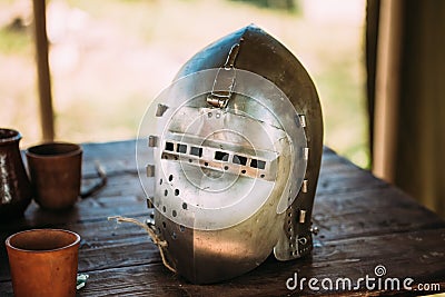 Knight Helmet Of Medieval Suit Of Armour On Table Stock Photo