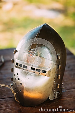 Knight Helmet Of Medieval Suit Of Armour On Table Stock Photo