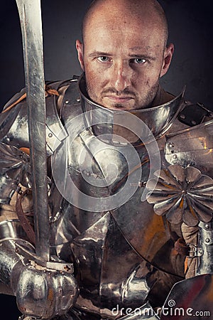 Knight wearing armor Stock Photo