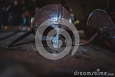 Knightly equipment. Medieval helmet and glove Stock Photo